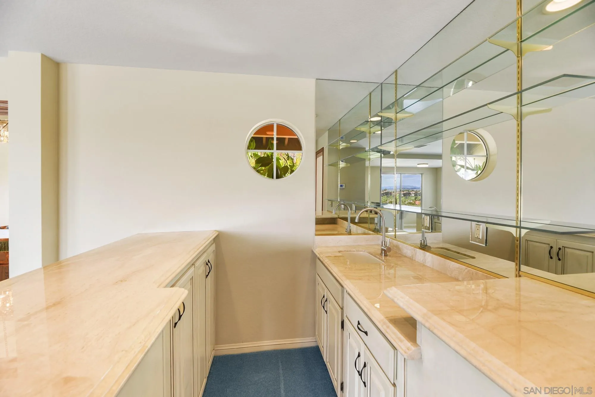 13000 Lomas Verdes Drive Poway, CA 92064 - Photo 24 of 58 a bathroom with a sink and a mirror