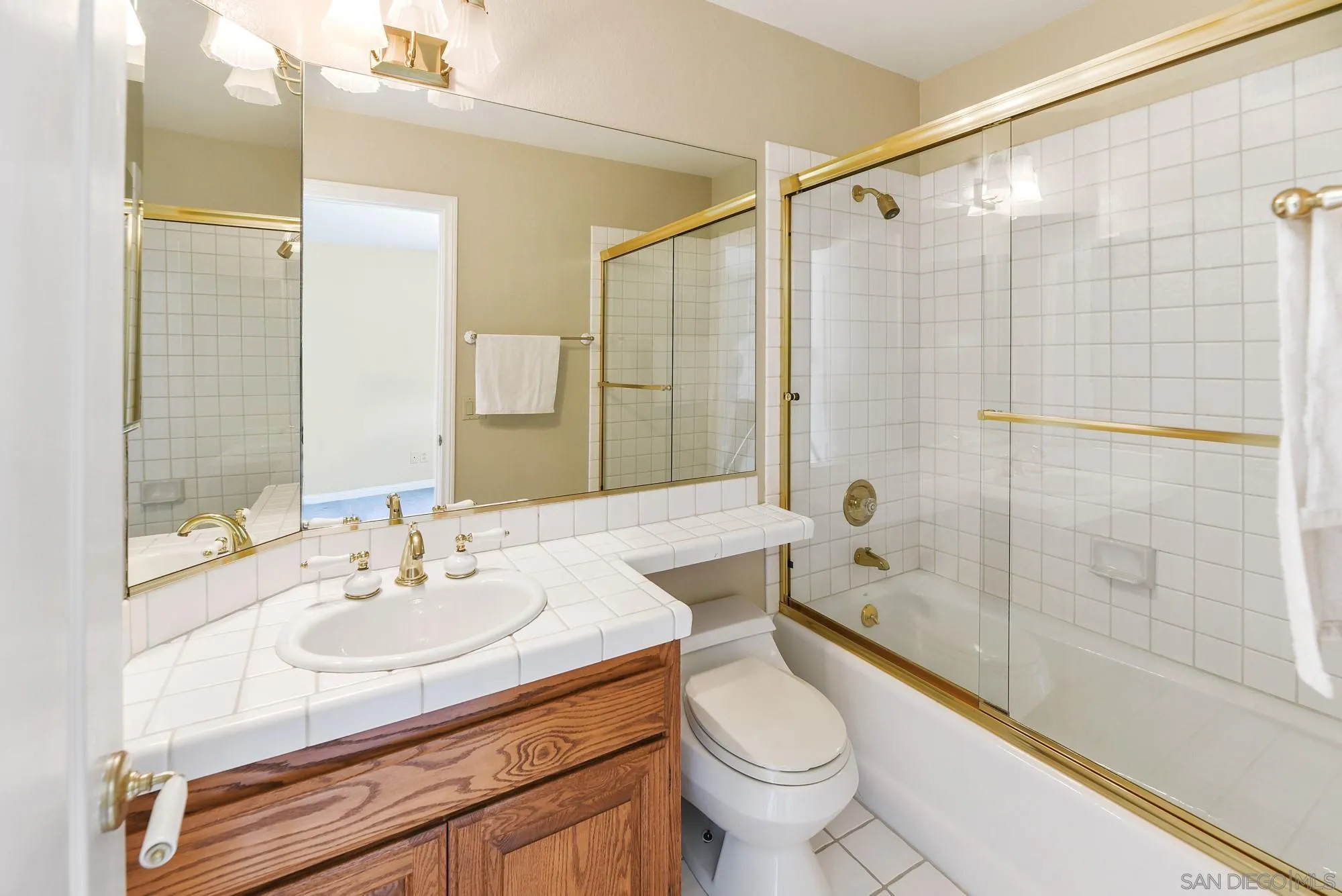 13000 Lomas Verdes Drive Poway, CA 92064 - Photo 28 of 58 a bathroom with a sink toilet and shower