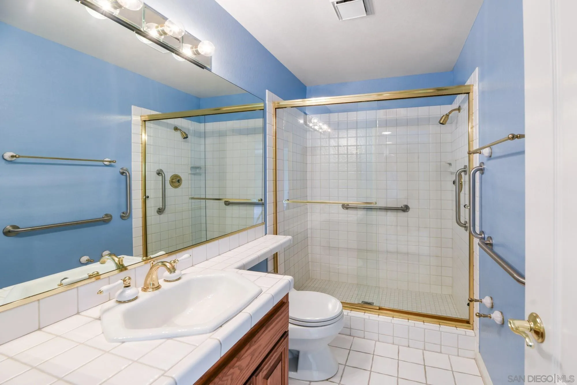 13000 Lomas Verdes Drive Poway, CA 92064 - Photo 29 of 58 a bathroom with a sink a toilet and shower