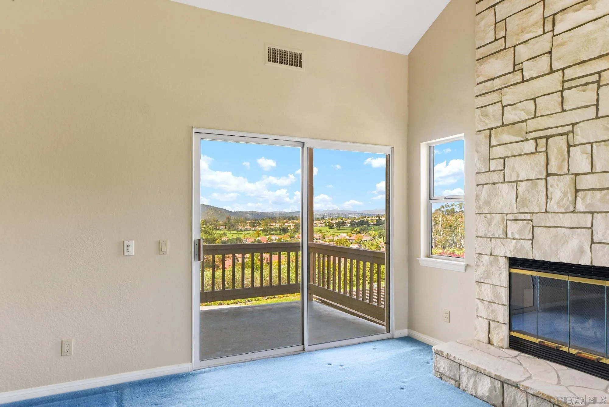 13000 Lomas Verdes Drive Poway, CA 92064 - Photo 31 of 58 a view of a livingroom with wooden floor and a fireplace