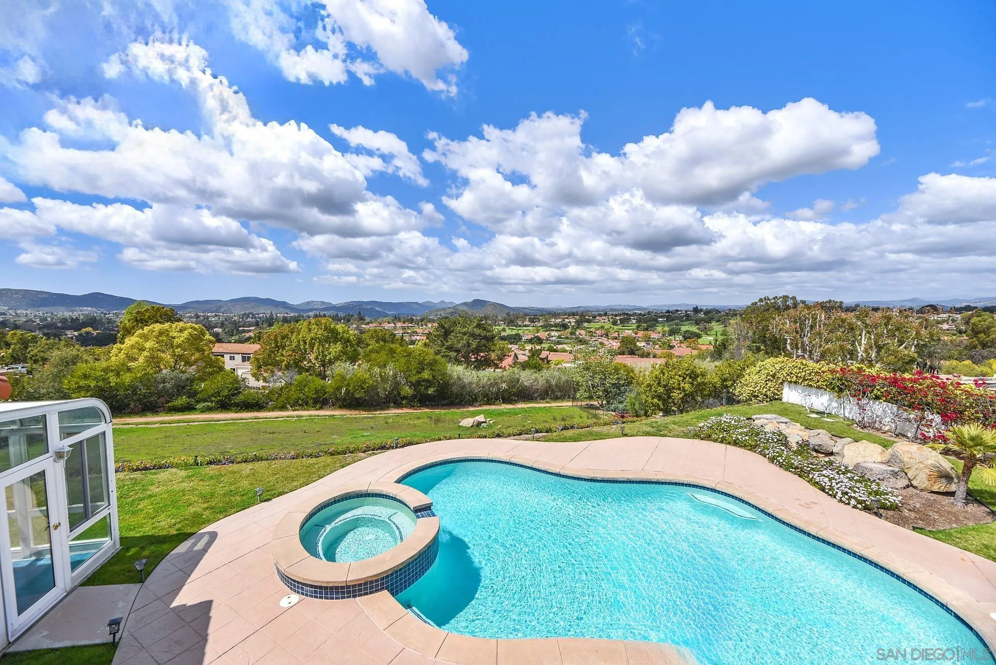 13000 Lomas Verdes Drive Poway, CA 92064 - Photo 34 of 58 a view of a swimming pool with a yard