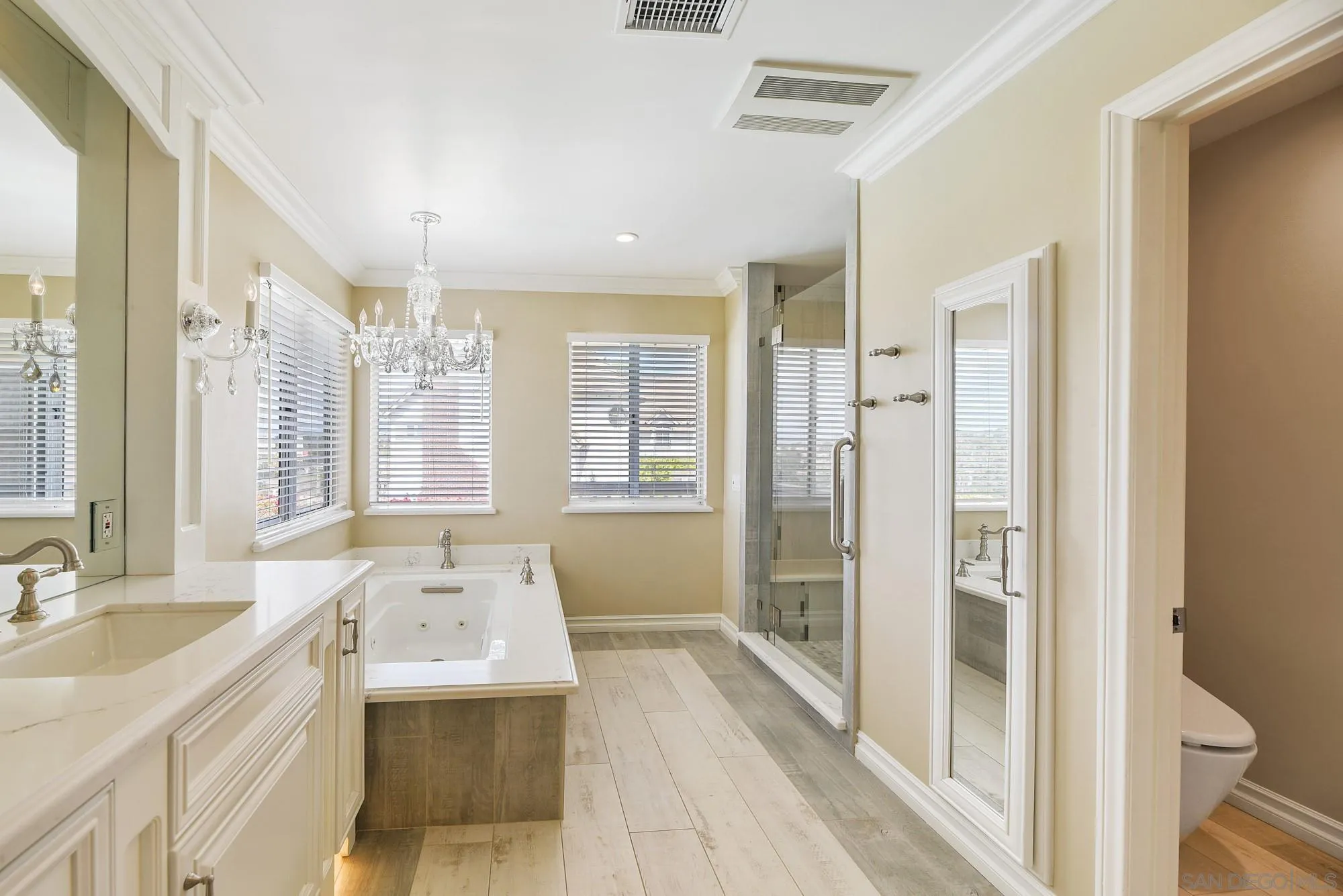 13000 Lomas Verdes Drive Poway, CA 92064 - Photo 35 of 58 a spacious bathroom with a tub sink shower and a mirror