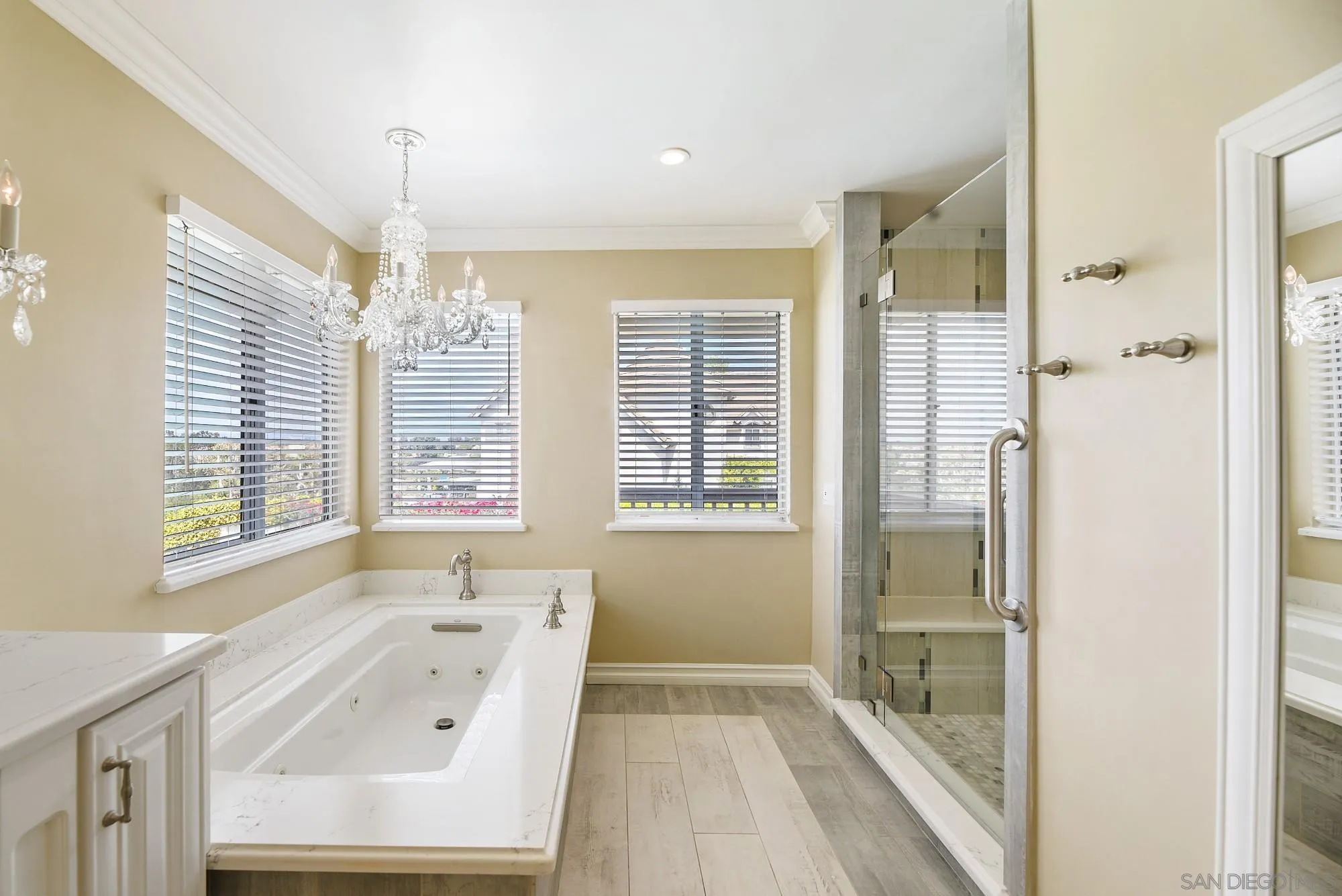13000 Lomas Verdes Drive Poway, CA 92064 - Photo 36 of 58 a bathroom with a tub sink and window