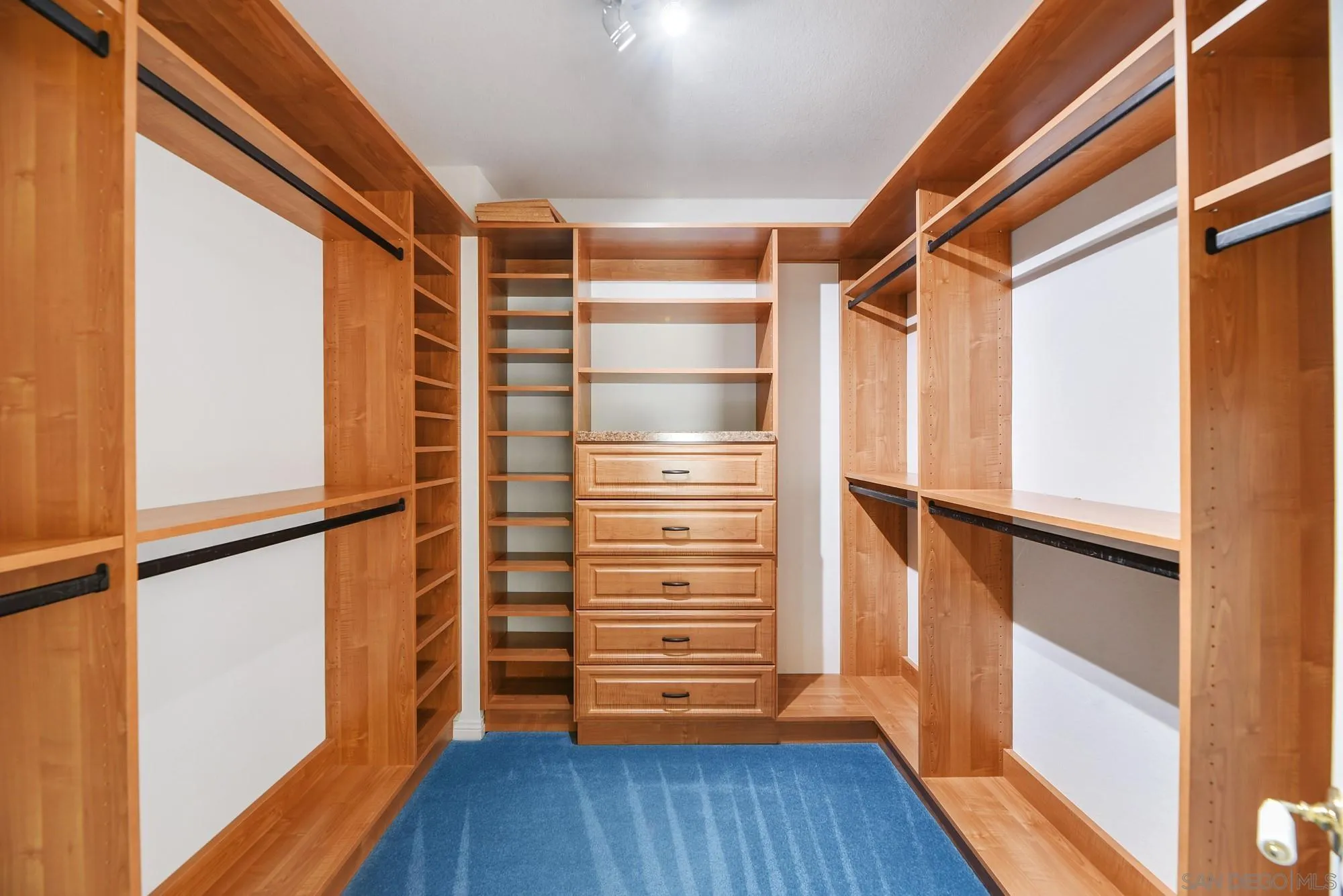 13000 Lomas Verdes Drive Poway, CA 92064 - Photo 39 of 58 a view of walk in closet with wooden floor