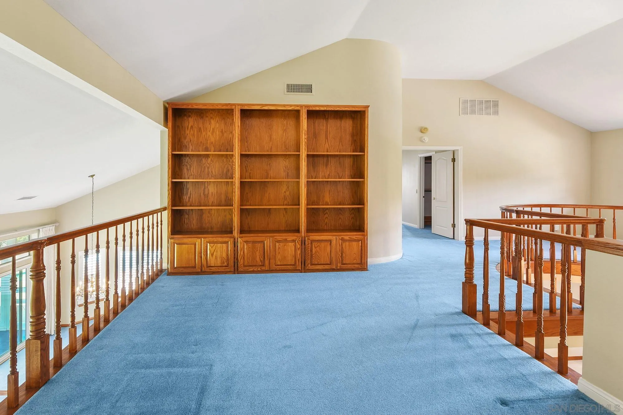 13000 Lomas Verdes Drive Poway, CA 92064 - Photo 40 of 58 a view of an empty room with wooden floor and stairs