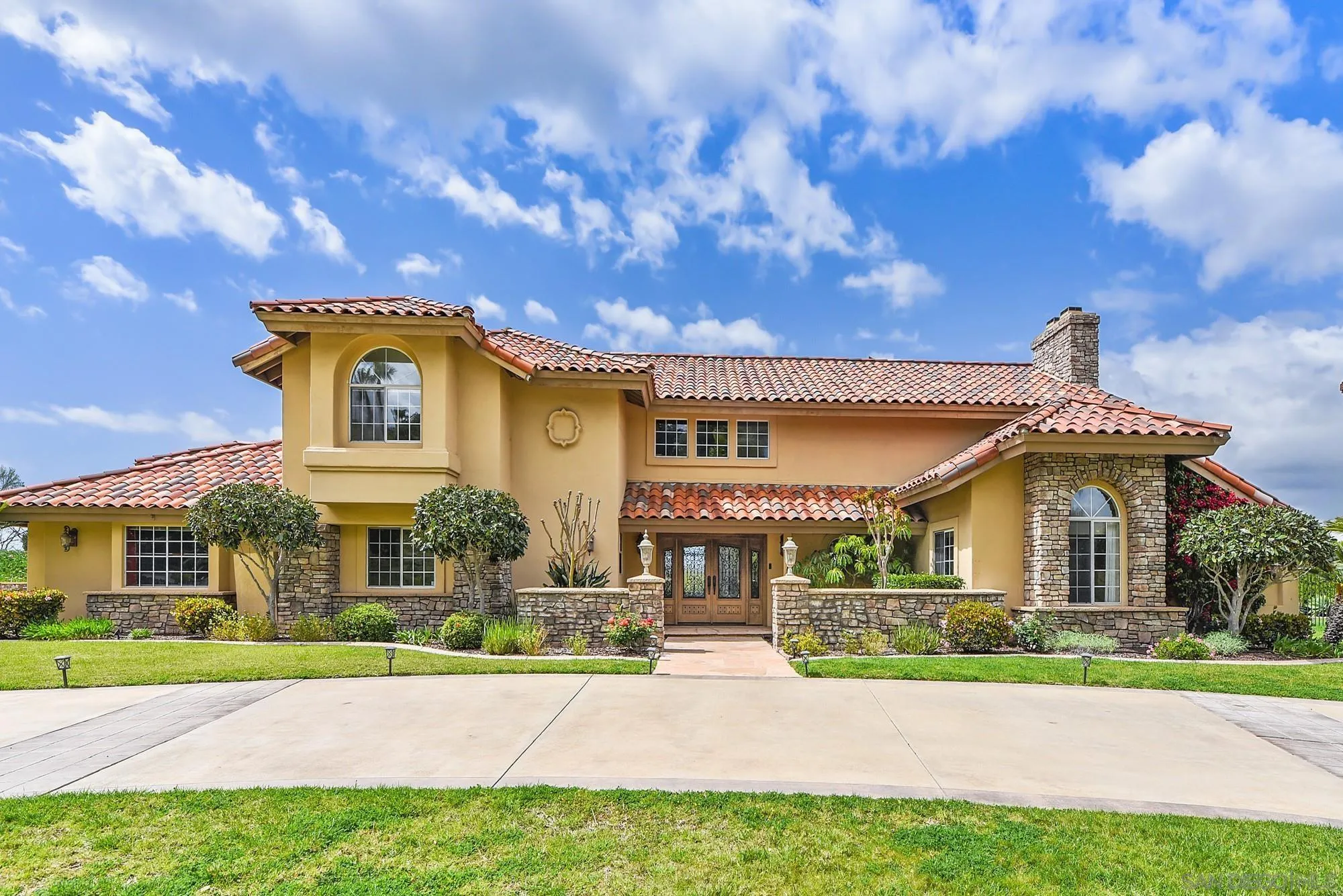 13000 Lomas Verdes Drive Poway, CA 92064 - Photo 58 of 58 a front view of a house with a yard and porch