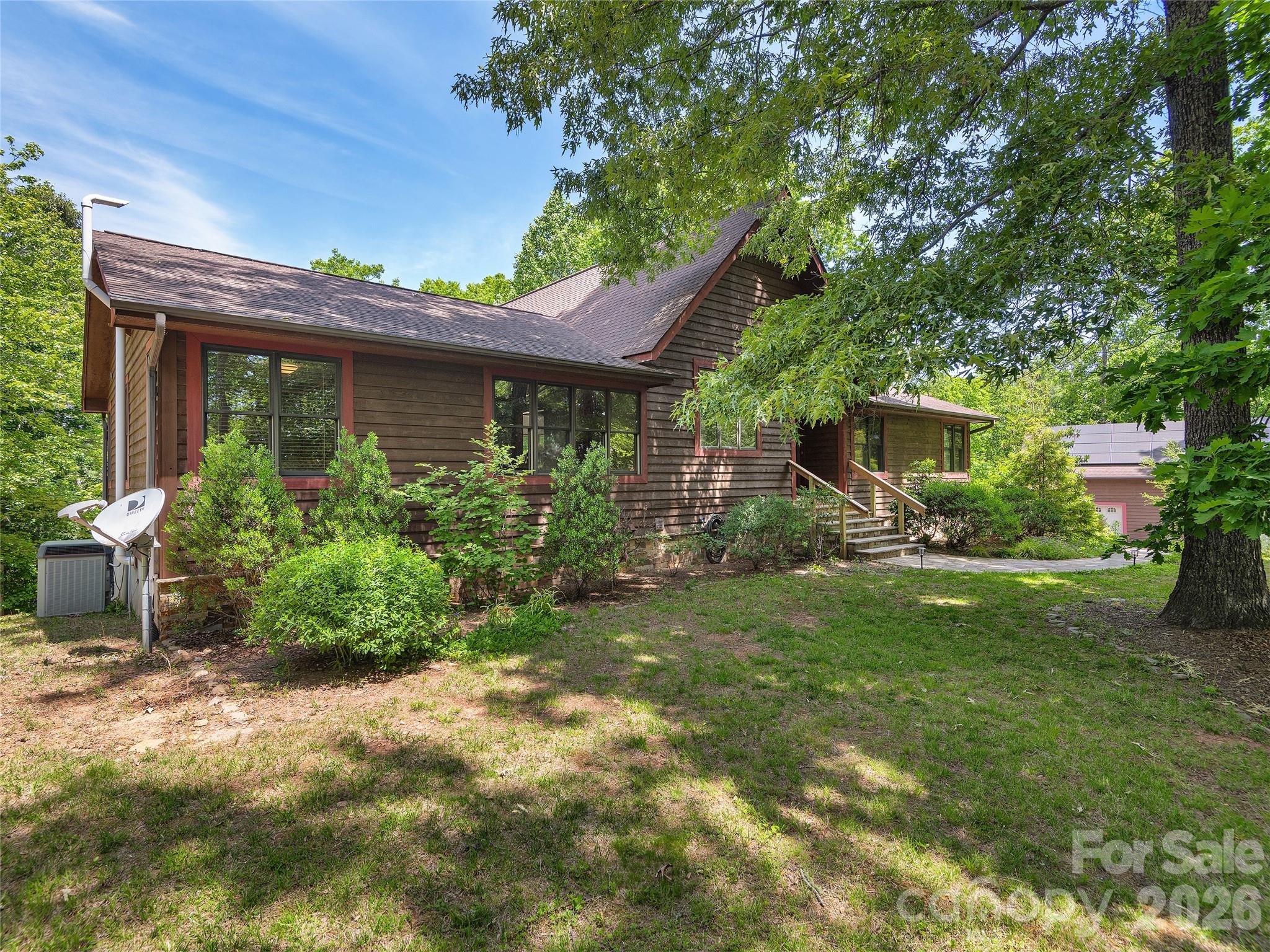 40 Deer Ridge Road Mills River, NC 28759 - Photo 35 of 35 a view of a house with a garden