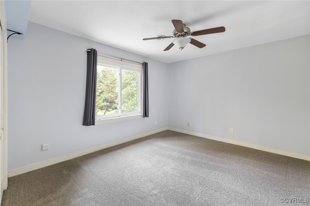 3202 Fortunes Ridge Road Midlothian, VA 23112 - Photo 23 of 29 an empty room with ceiling fan and windows