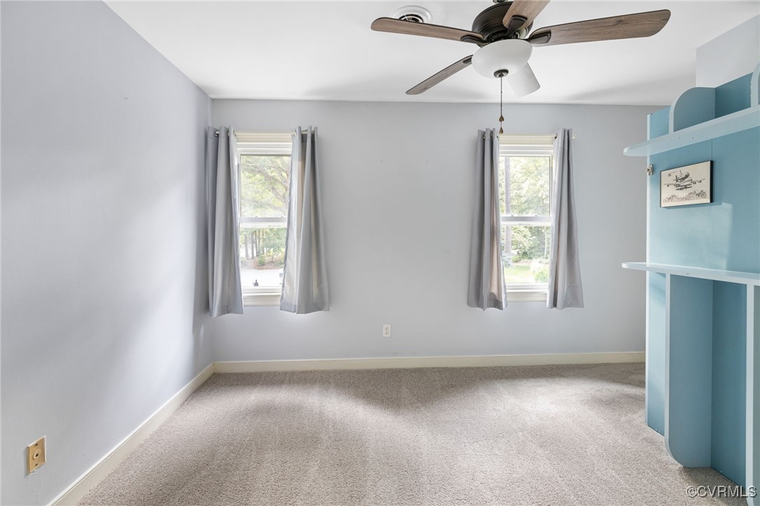 3202 Fortunes Ridge Road Midlothian, VA 23112 - Photo 27 of 29 an empty room with windows and fan