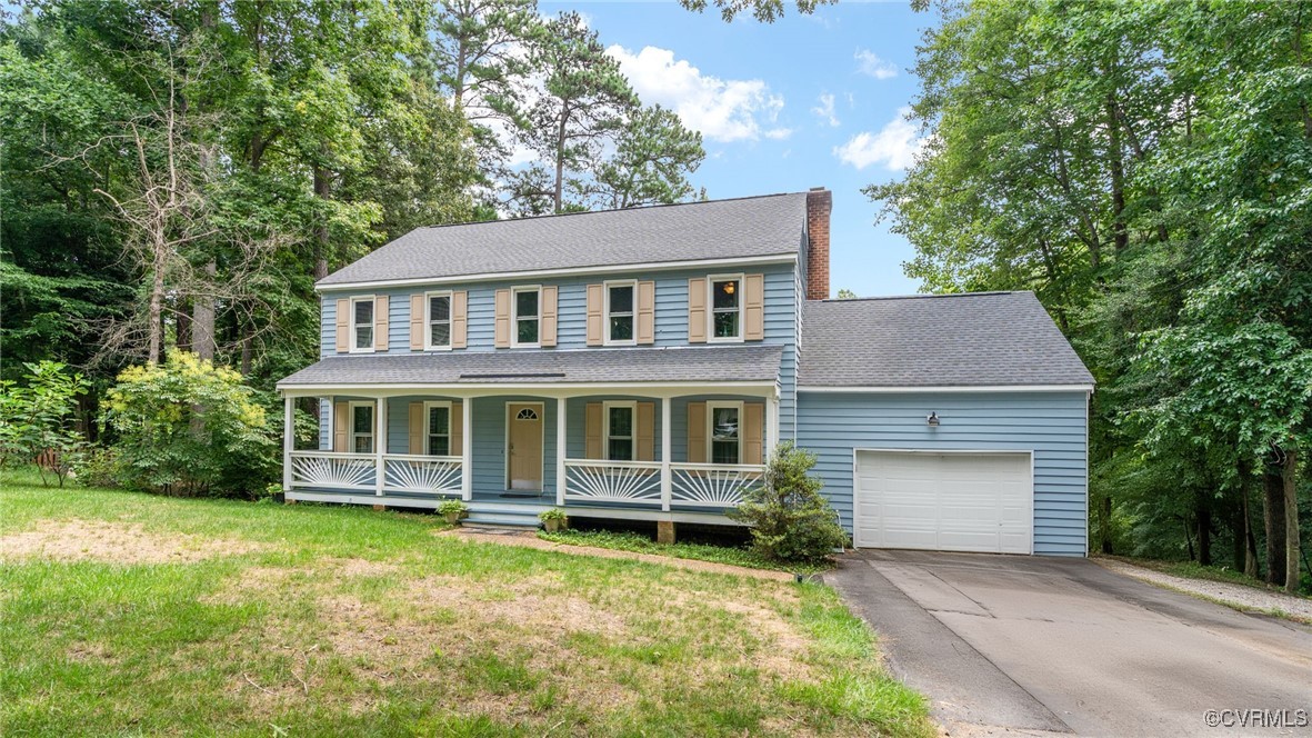 3202 Fortunes Ridge Road Midlothian, VA 23112 - Photo 3 of 29 a front view of a house with a yard and garage