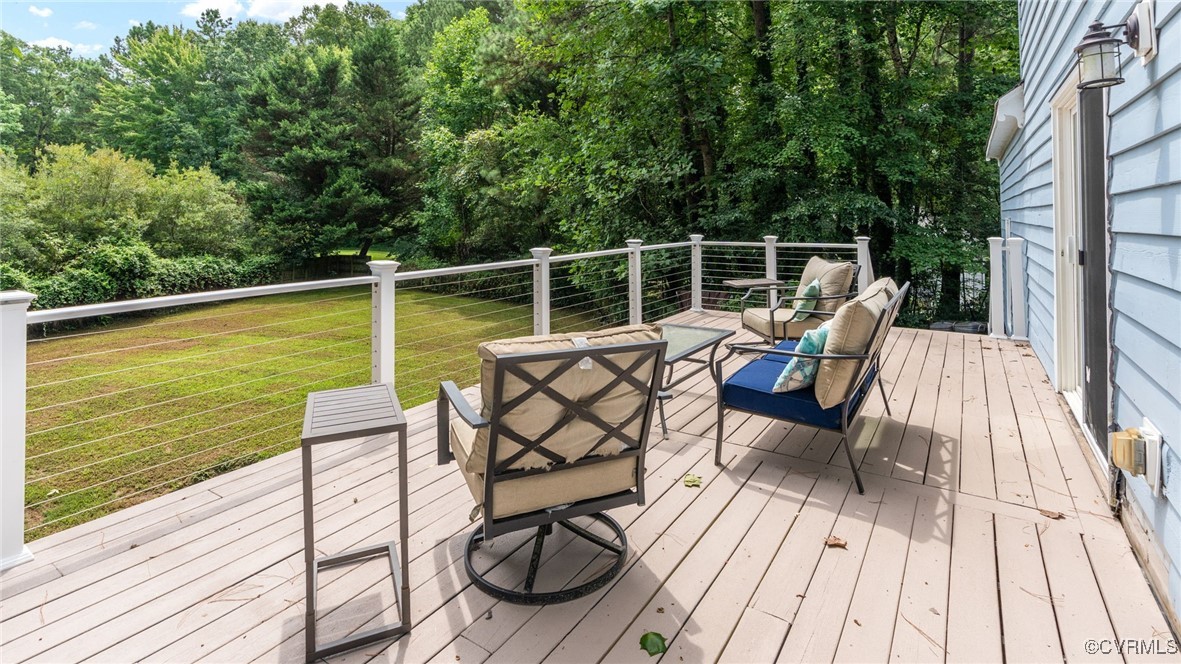 3202 Fortunes Ridge Road Midlothian, VA 23112 - Photo 6 of 29 a view of a patio with chairs on wooden floor