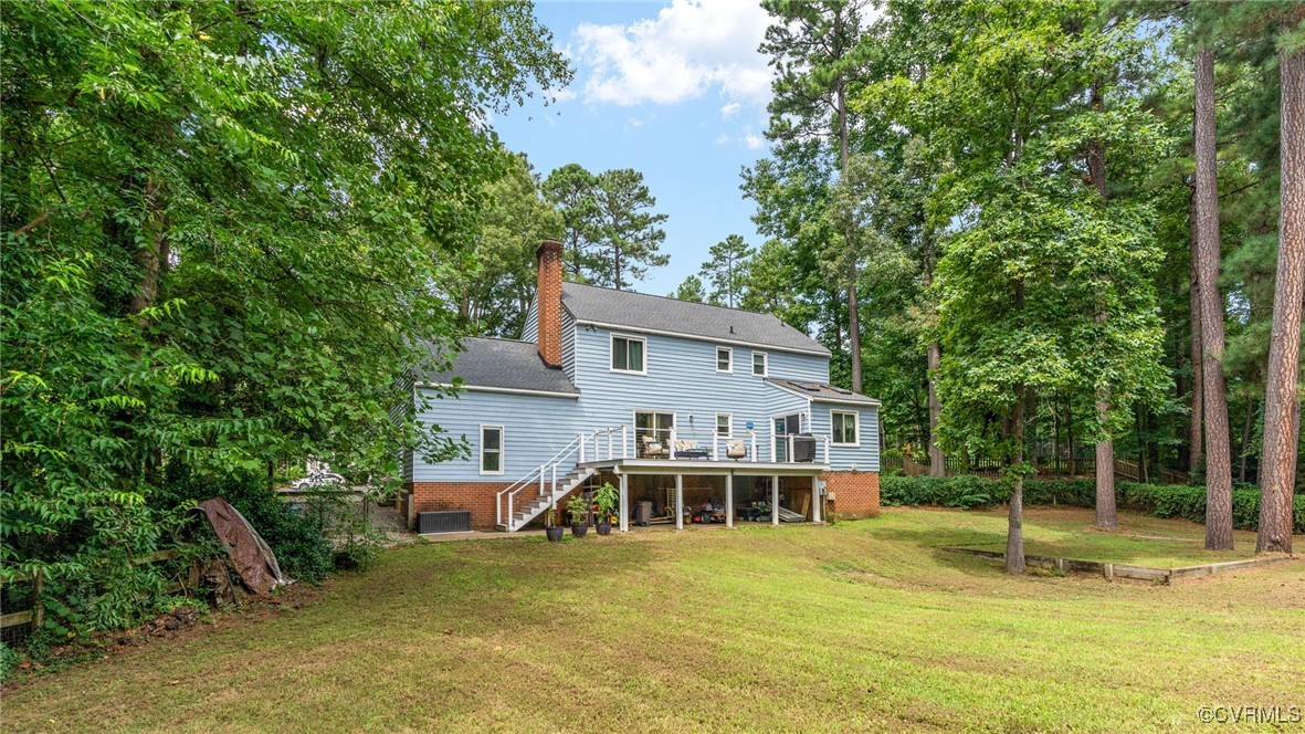 3202 Fortunes Ridge Road Midlothian, VA 23112 - Photo 7 of 29 front view of a house with a yard table and chairs