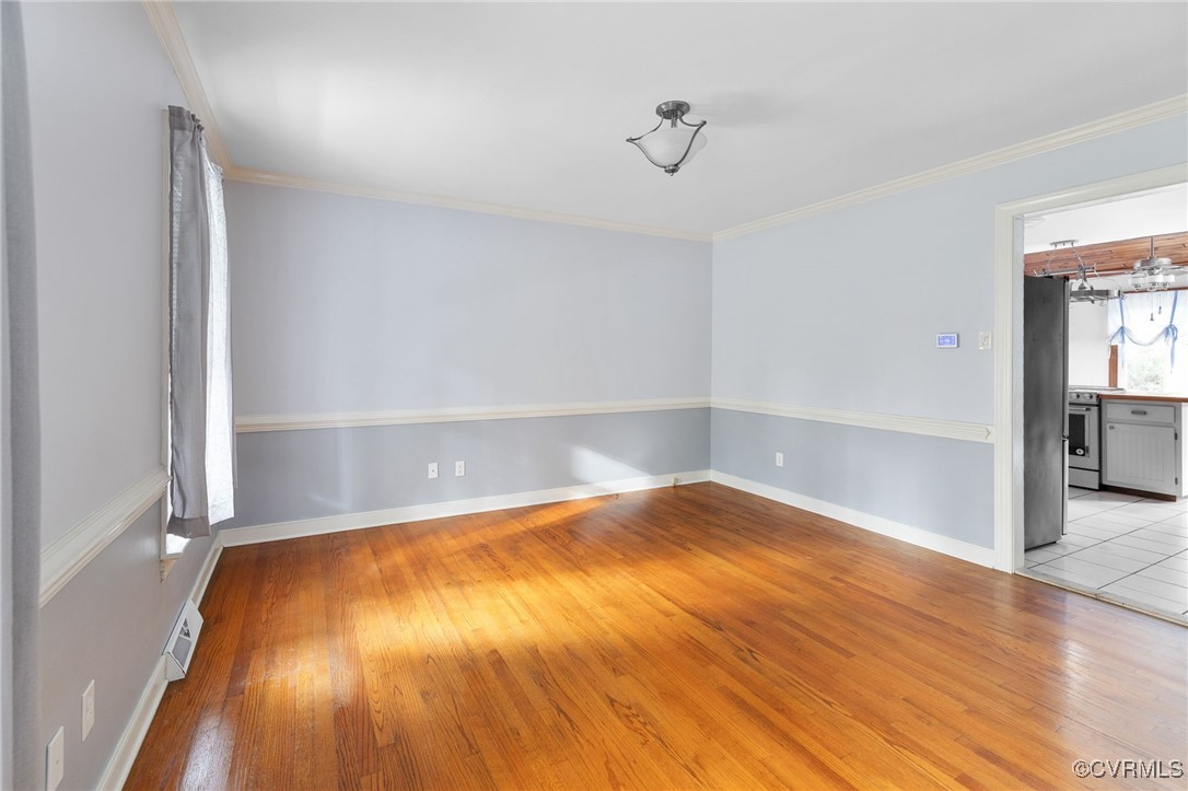 3202 Fortunes Ridge Road Midlothian, VA 23112 - Photo 10 of 29 a view of an empty room with wooden floor and a window