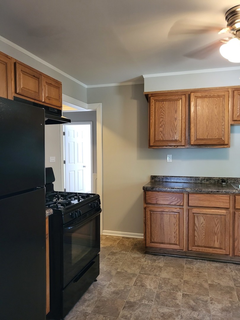 644 Rochelle Terrace Lombard, IL 60148 - Photo 9 of 31 a kitchen with stainless steel appliances granite countertop a refrigerator and a stove