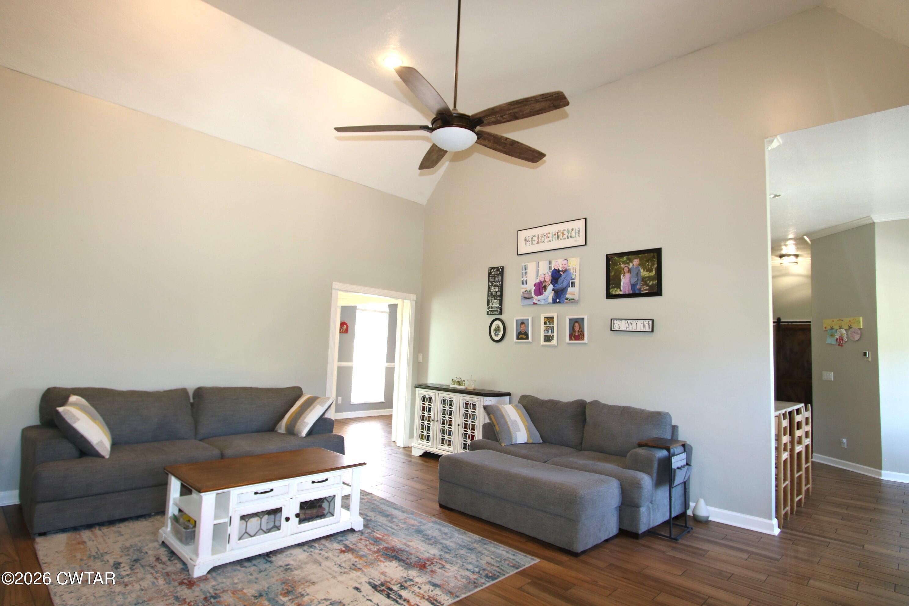 98 Browning Road Milan, TN 38358 - Photo 17 of 60 a living room with furniture and a wooden floor