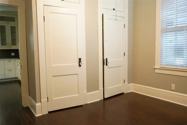 a view of an entryway with wooden floor
