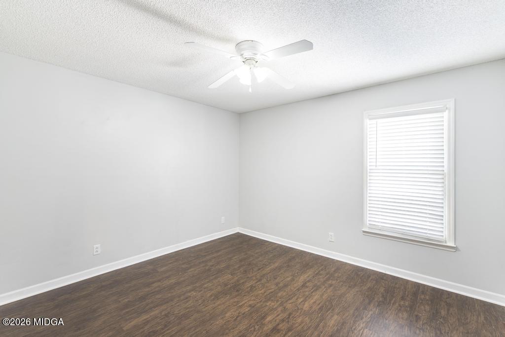 3710 Sandy Circle Macon, GA 31216 - Photo 21 of 44 an empty room with wooden floor and windows