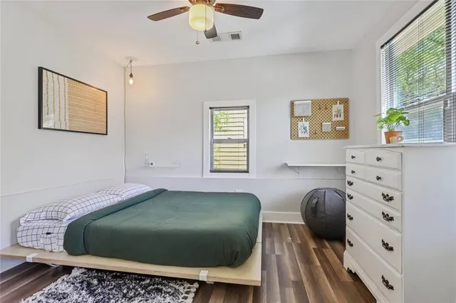 a bedroom with a bed and window