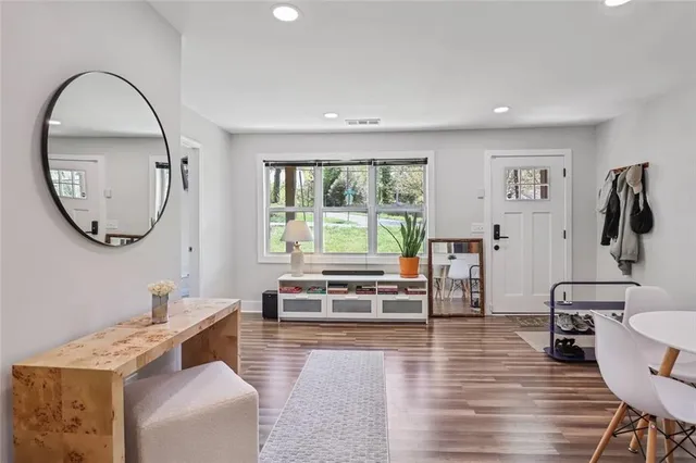 a living room with furniture and a large window