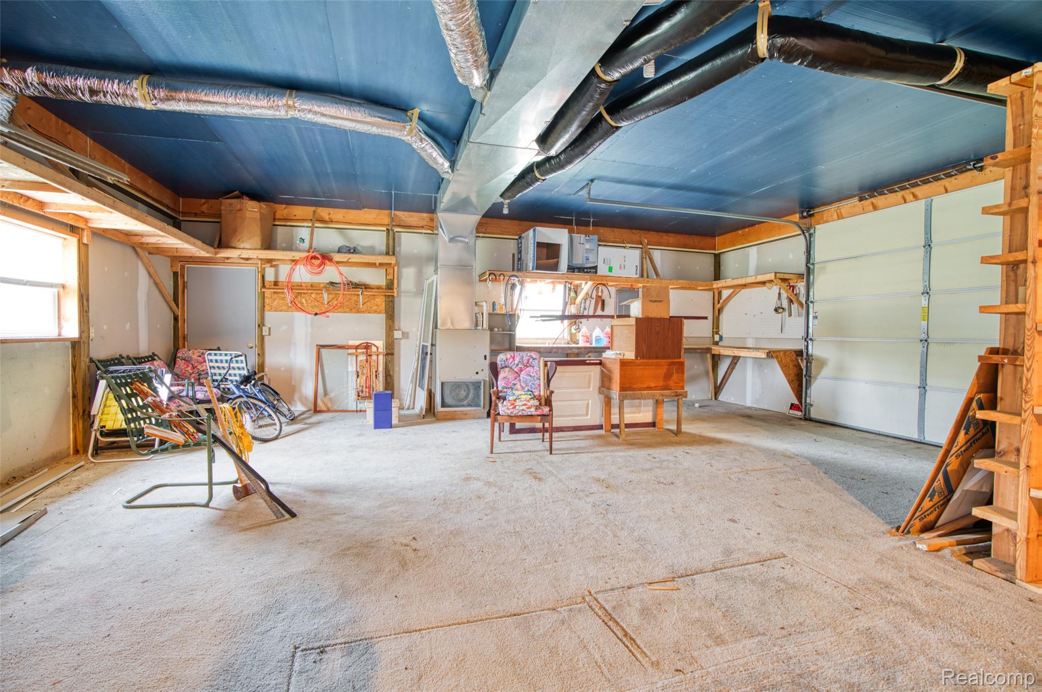 5601 West Lovejoy Road Byron, MI 48418 - Photo 35 of 40 Below grade area featuring a garage