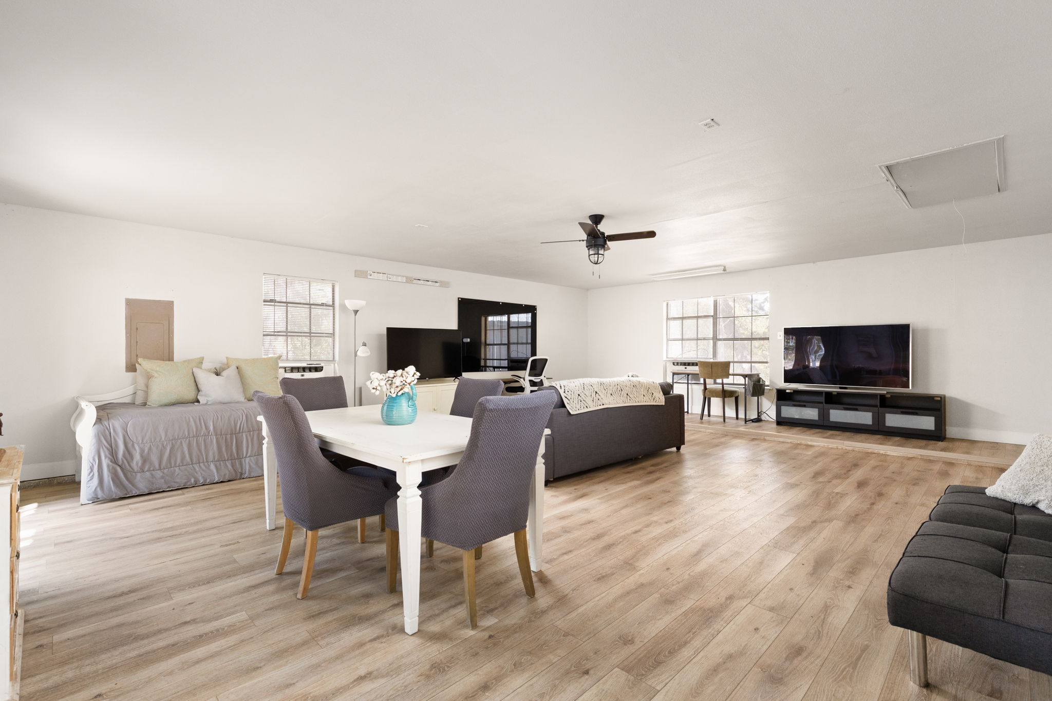 196 Willy Road Bastrop, TX 78602 - Photo 20 of 40 Warm wood floors flow through this generous open living and dining layout.