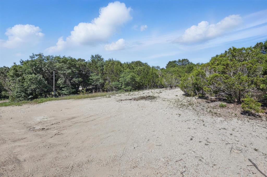 4900 Shining Star Trail Rio Vista, TX 76093 - Photo 4 of 11 a view of beach and covered with trees