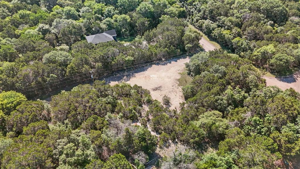 4900 Shining Star Trail Rio Vista, TX 76093 - Photo 9 of 11 a view of a house with a yard and large trees