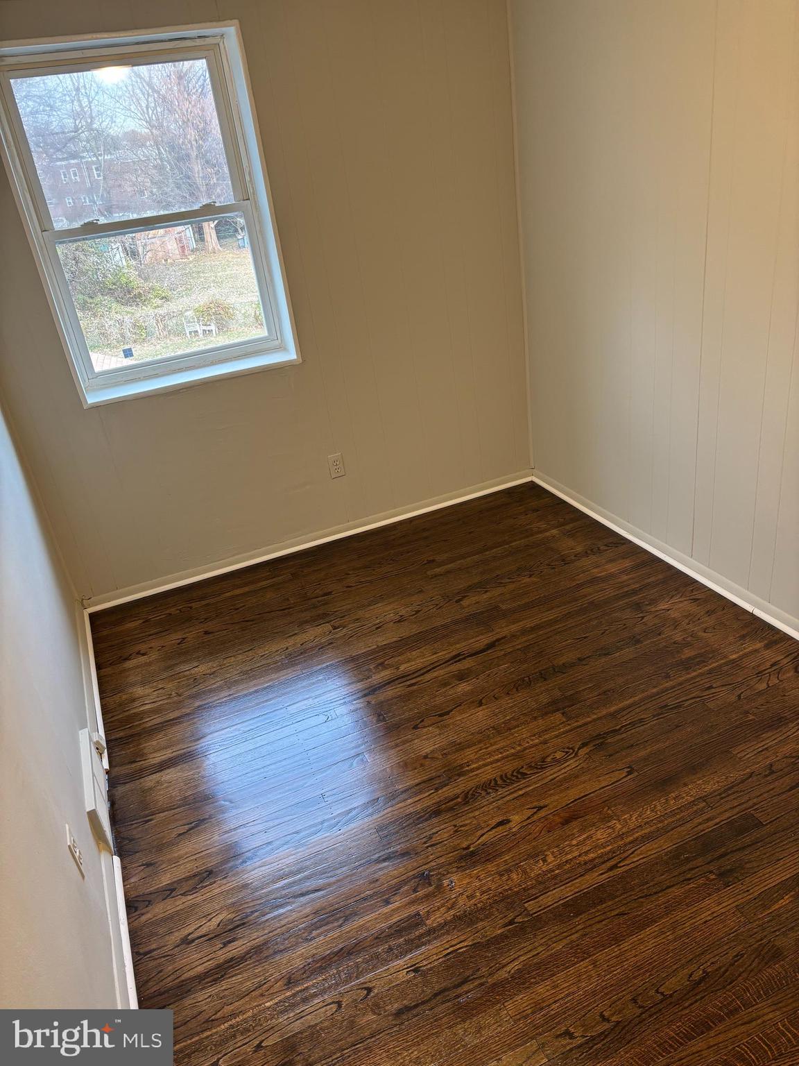 1948 Carter Road Folcroft, PA 19032 - Photo 6 of 8 an empty room with wooden floor and windows