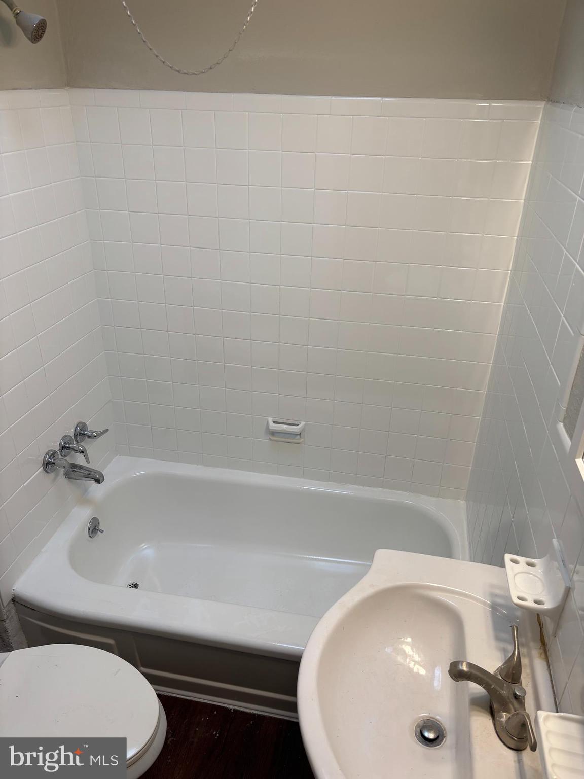 1948 Carter Road Folcroft, PA 19032 - Photo 7 of 8 a bathroom with a sink and a bathtub
