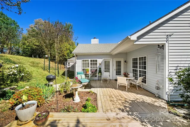 a front view of house with yard outdoor seating and green space