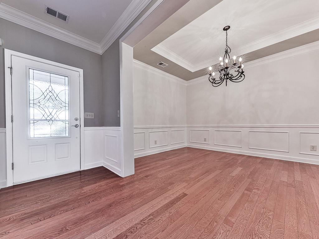 626 Laurel Crossing Canton, GA 30114 - Photo 9 of 77 wooden floor in an empty room with a window