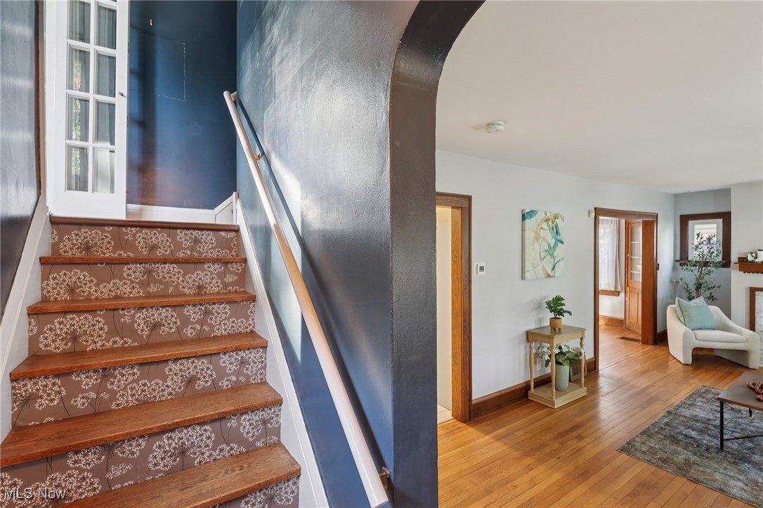 2482 Princeton Road Cleveland, OH 44118 - Photo 12 of 32 Stairway with wood-type flooring and arched walkways