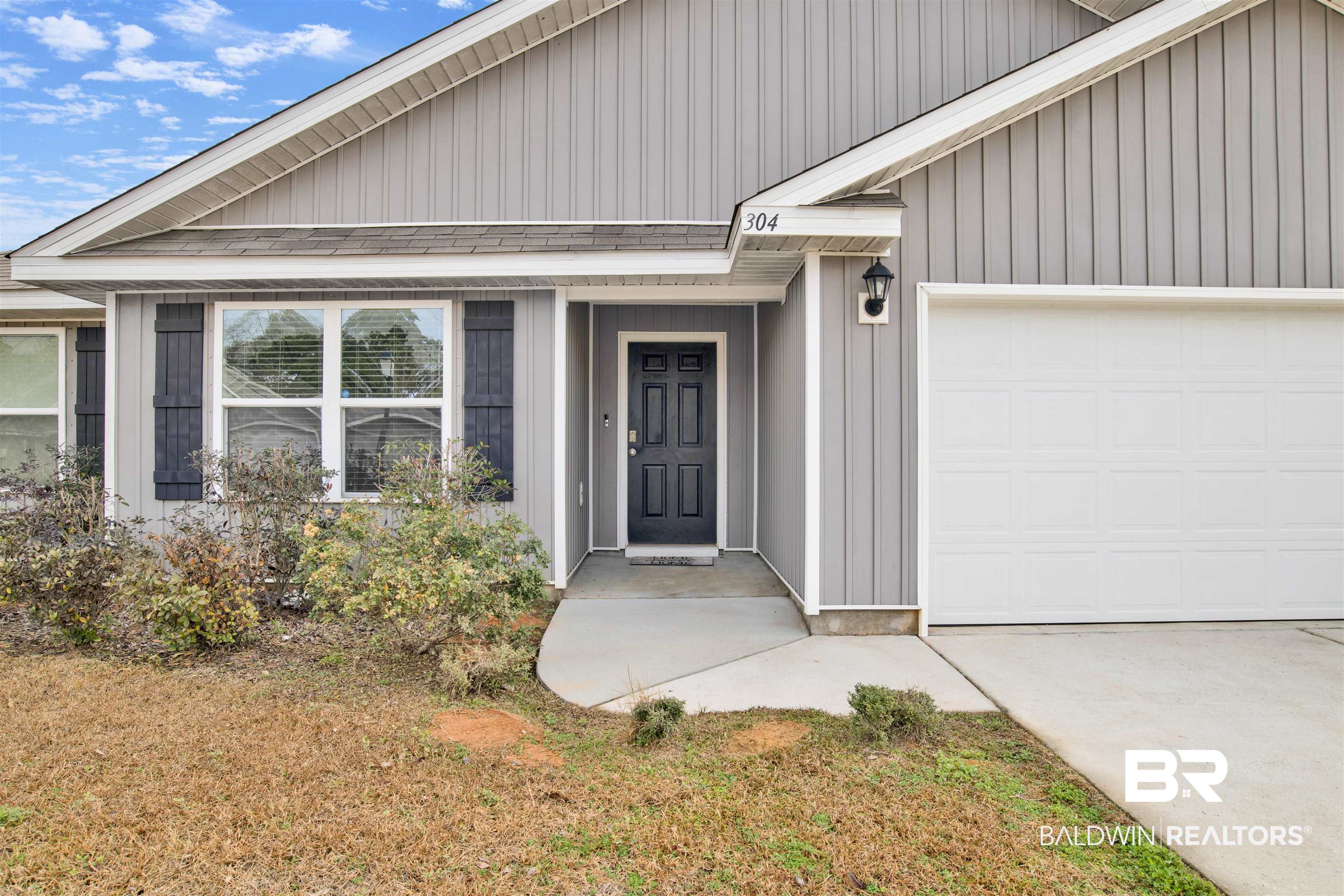 304 Hartenstein Road Foley, AL 36535 - Photo 5 of 28 View of exterior entry with a garage