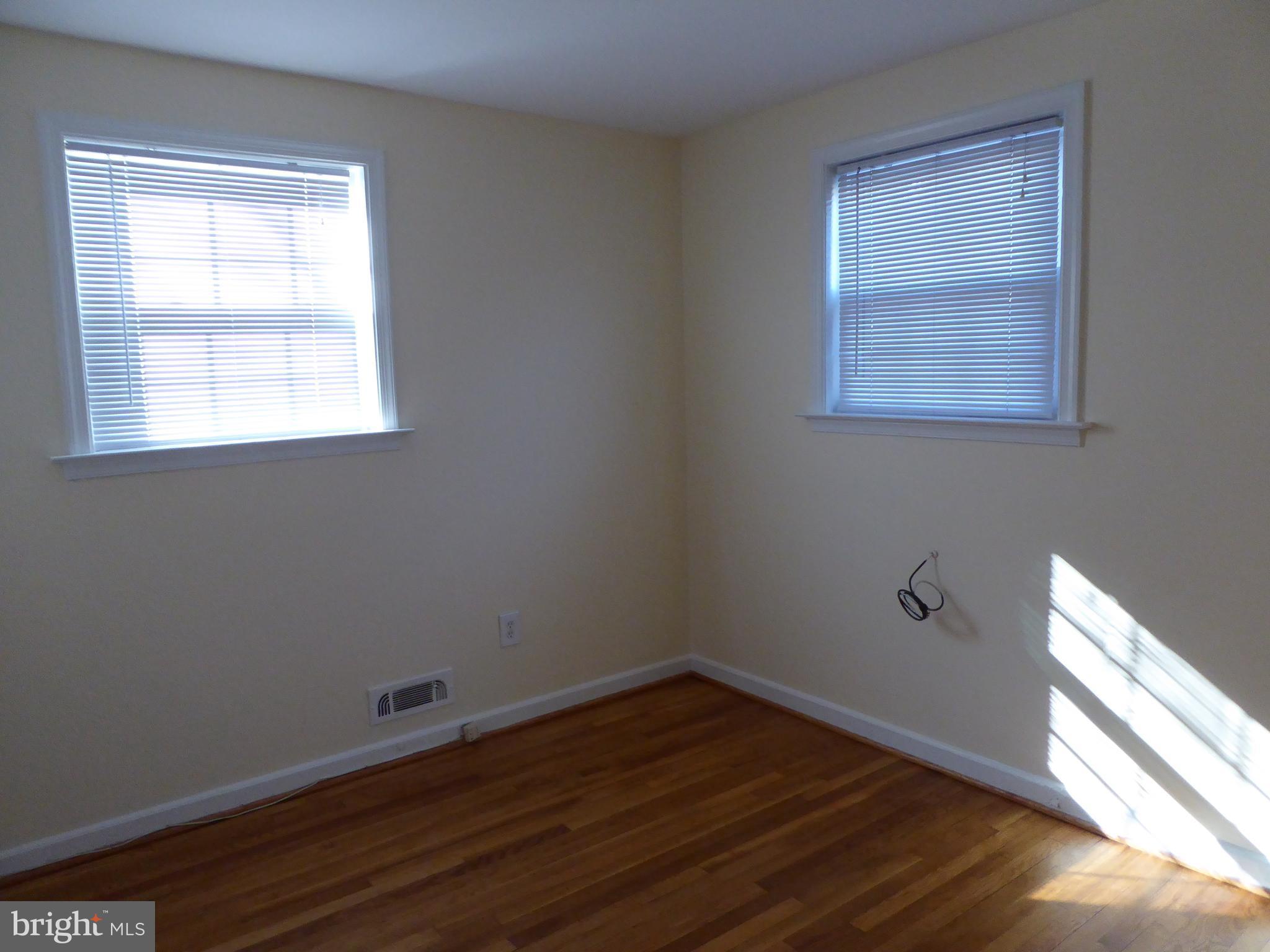 12820 Crisfield Road Silver Spring, MD 20906 - Photo 14 of 24 a view of a small space with wooden floor and a window