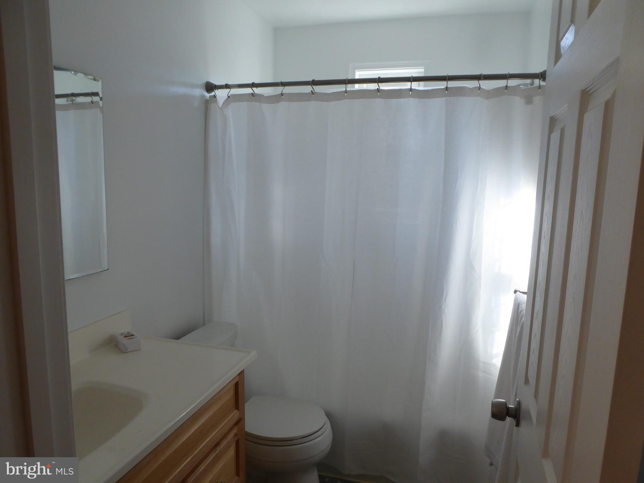 12820 Crisfield Road Silver Spring, MD 20906 - Photo 15 of 24 a bathroom with a shower and a toilet