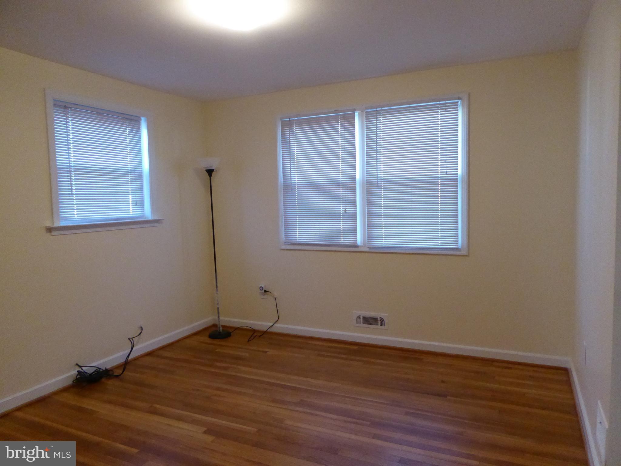 12820 Crisfield Road Silver Spring, MD 20906 - Photo 16 of 24 a view of a room with wooden floor and windows