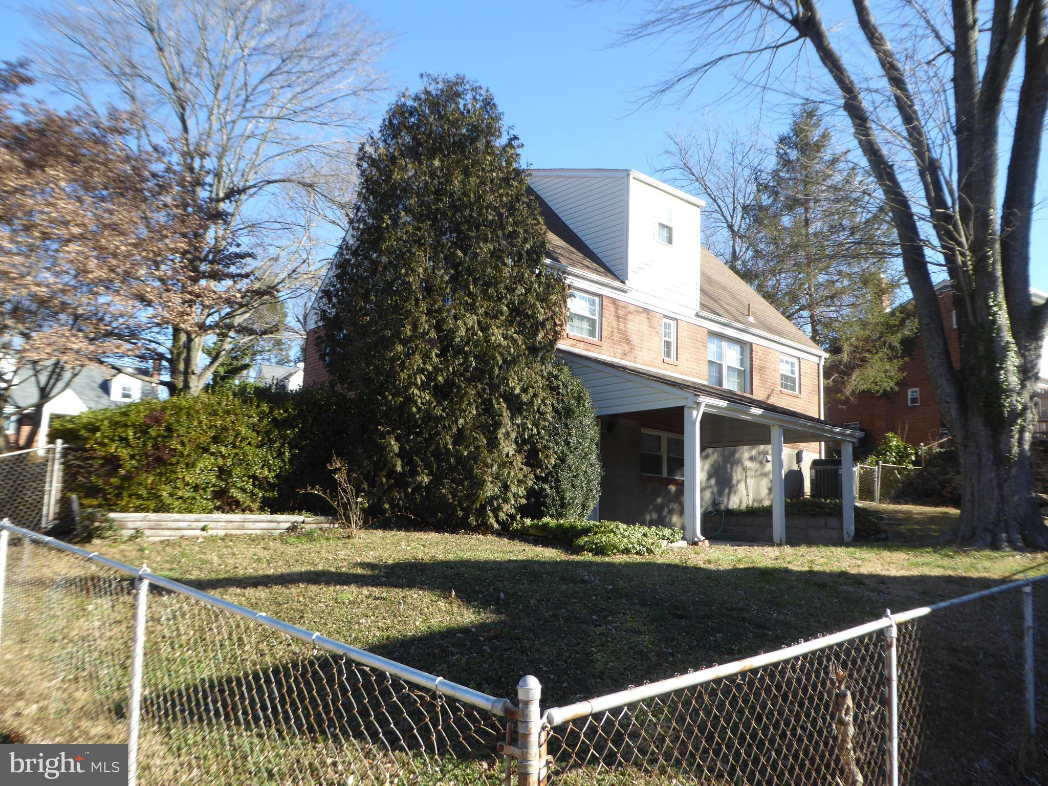 12820 Crisfield Road Silver Spring, MD 20906 - Photo 4 of 24 a view of a building with a yard