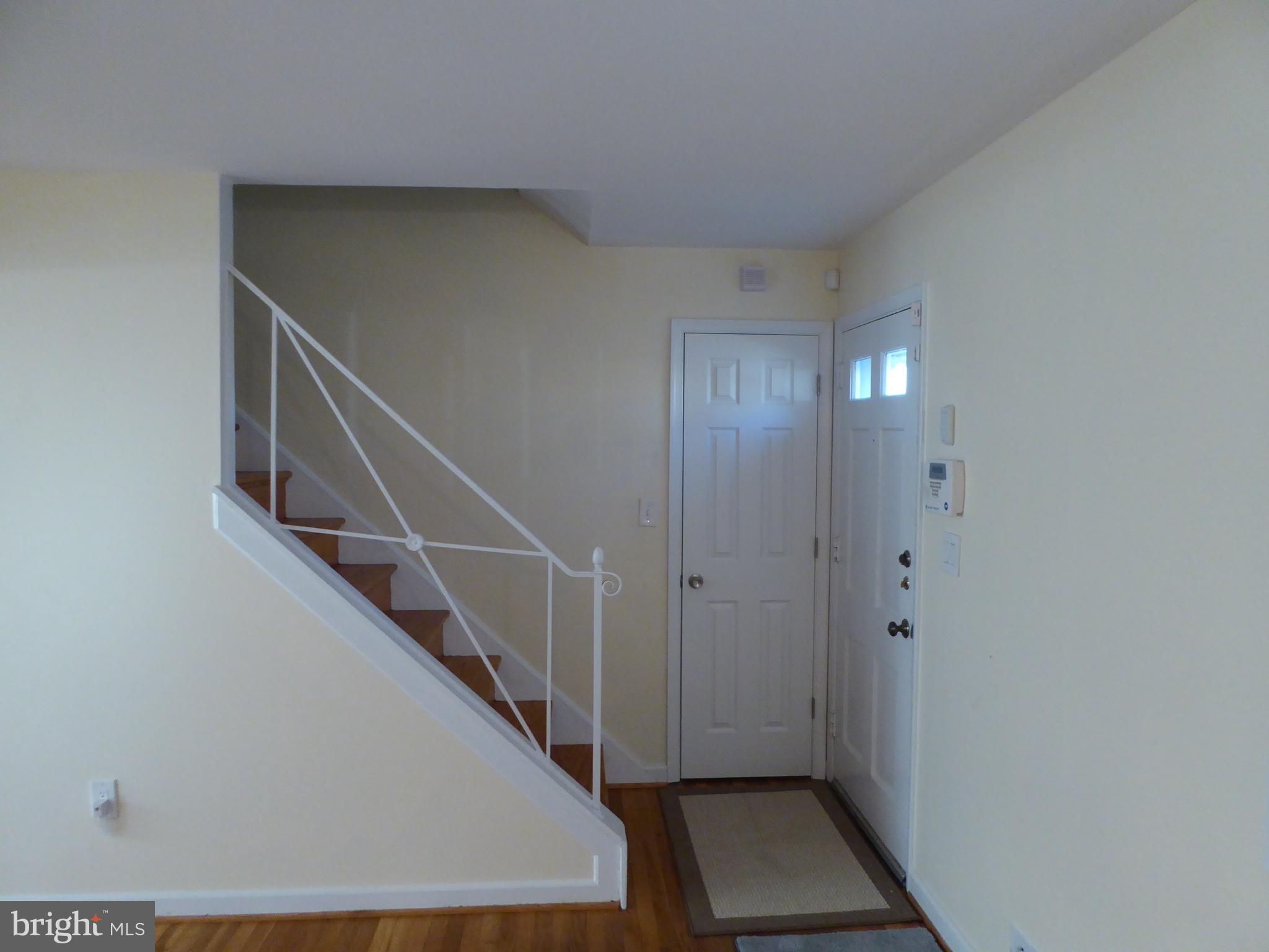 12820 Crisfield Road Silver Spring, MD 20906 - Photo 5 of 24 a view of entryway and hall with wooden floor