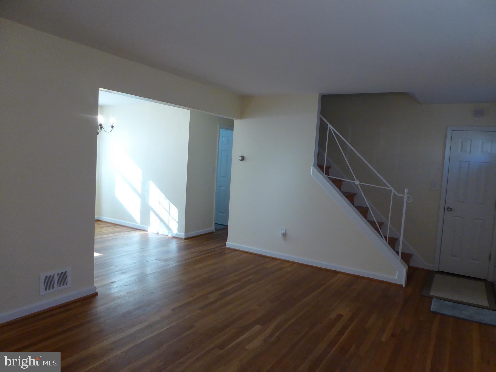 12820 Crisfield Road Silver Spring, MD 20906 - Photo 8 of 24 a view of a hallway with wooden floor