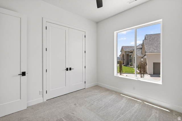2862 South Mountain Rnch Road Cedar City, UT 84720 - Photo 38 of 64 Bright interior space featuring a large window, carpeted flooring, and white walls