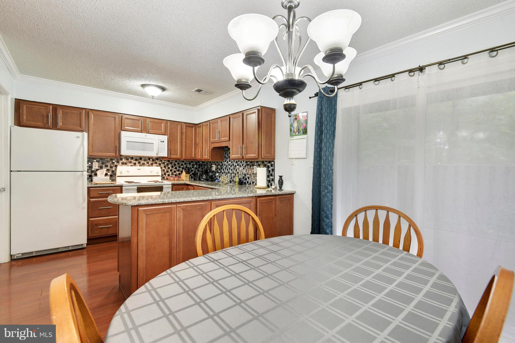 2186 White Cornus Lane Reston, VA 20191 - Photo 13 of 28 Lovely open kitchen into dining room.