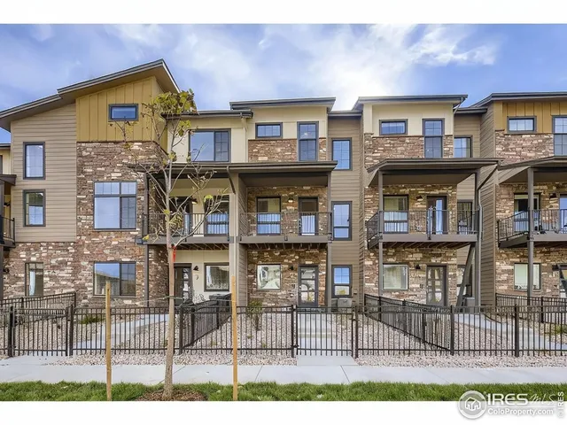 a view of a brick building with many windows