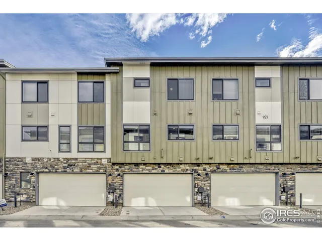a front view of a house with large windows
