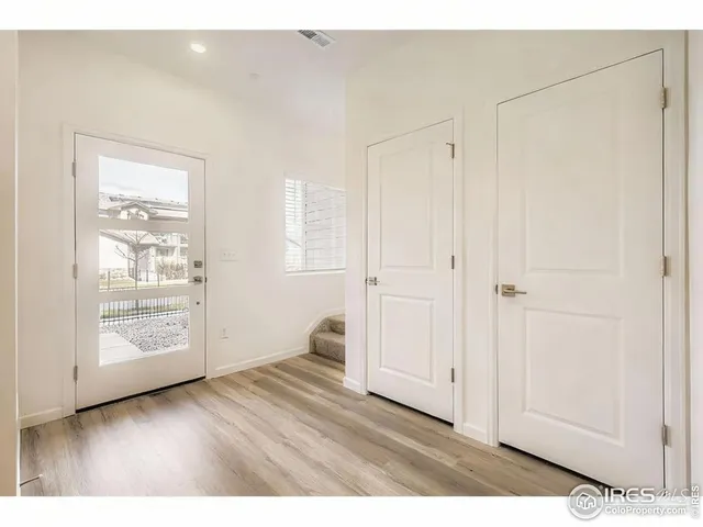 a view of an empty room and glass door