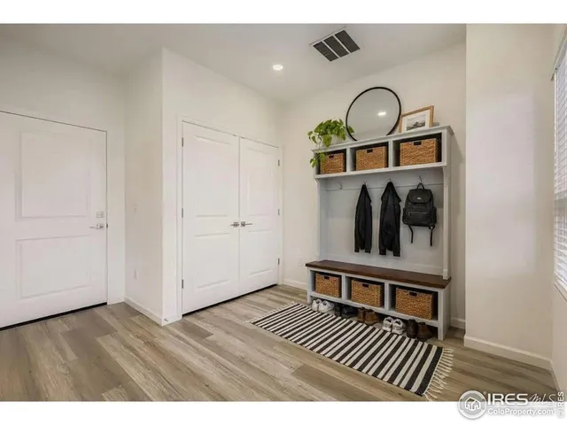 a view of entryway with wooden floor
