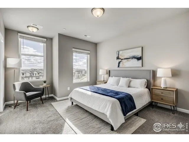 a bedroom with a bed and a couch