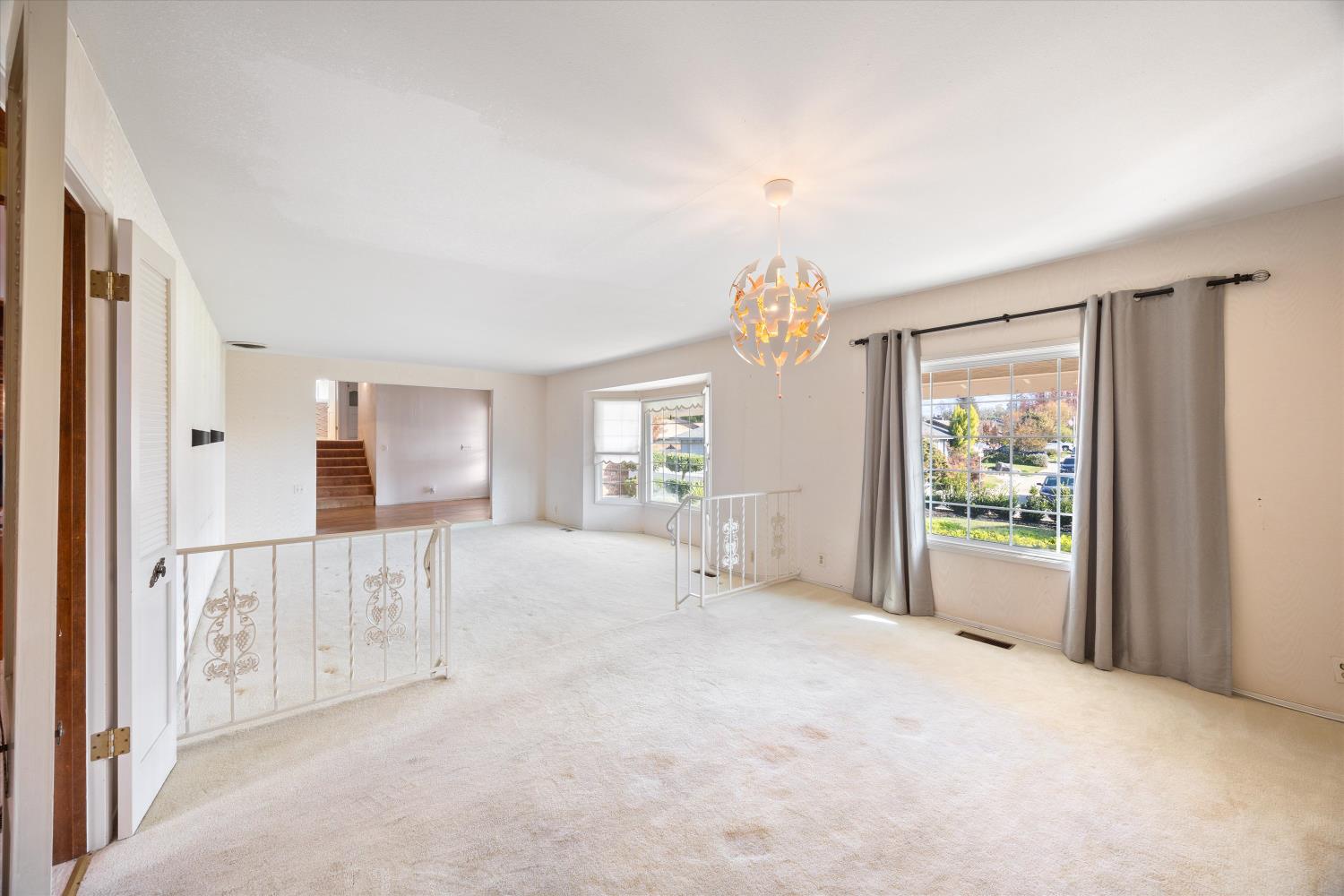 1786 Le Bec Court Lodi, CA 95240 - Photo 17 of 65 a view of a bedroom with wooden floor and windows
