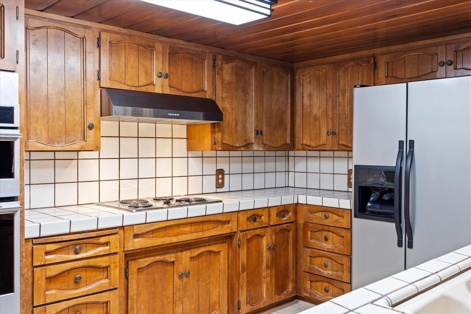 1786 Le Bec Court Lodi, CA 95240 - Photo 22 of 65 a kitchen with stainless steel appliances granite countertop a refrigerator and a stove top oven