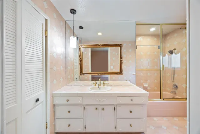 a view of a storage and utility room with washer and dryer
