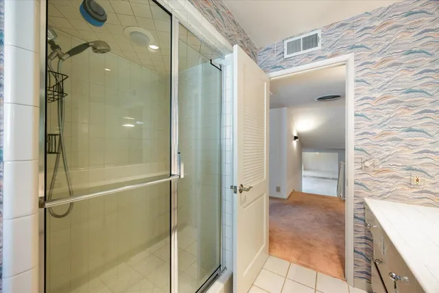 a view of a porch with wooden floor and fence